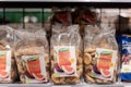 Munich, Germany - 2021 02 05: Plastic free bags made from wooden fibres with whole figs of brand dennree in shelf on display in