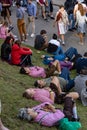 Munich, Germany, 2019 September 19: 4 mans sleeping in a row on the lawn at the Bavaria Oktoberfest in Munich