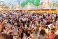 MUNICH, GERMANY - SEPTEMBER 17, 2016: People drink beer in the Hacker-Pschorr tent of the Oktoberfest in Munic
