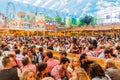 MUNICH, GERMANY - SEPTEMBER 17, 2016: People drink beer in the Hacker-Pschorr tent of the Oktoberfest in Munic