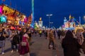 Munich, Germany - September 24: visitors, beertents and candy shops on the oktoberfest in munich at night
