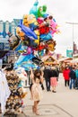 Woman posing with helium balloons at the Oktoberfest