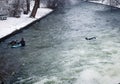 Munich, surfers swim to river edge at Englischer garten Royalty Free Stock Photo