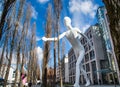 Munich, Germany- : The Walking Man Statue in front of the City Buildings Royalty Free Stock Photo