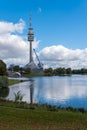 Munich Olympic Tower with the lake in the foreground. Royalty Free Stock Photo