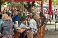 Munich, people seat at beer garden in Viktualienmarkt