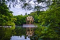 Munich Westpark Pagoda reflecting in the water with the trees in the background