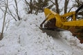 Municipal equipment removing snow outdoors cleaning roads in winter Royalty Free Stock Photo