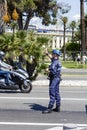 Municipal Policeman directs traffic in Nice