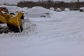 Municipal service removing snow on parking lot for car after snowfall Royalty Free Stock Photo