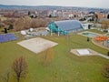 Municipal sports complex with a covered swimming pool with a water slide and sports grounds. Modern design. Healthy lifestyle. Spo Royalty Free Stock Photo