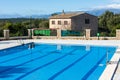 Municipal swimming pool with mountains in the background in Costitx, Mallorca, Spain