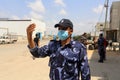 A municipal worker disinfects a truck at a checkpoint in Rafah in the southern Gaza Strip