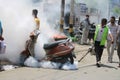 Municipal worker fogging in the market to fight dengue in Covid pandemic.