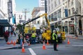 Municipal workers make city infrastructure service activity at downtown street