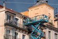 Municipal workers reparing a building on elevator at Plaza Mayor, SegoviaSpain