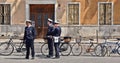 01.05.2016. Municipality police patrol on the street of Padua with bicycles and old building in back ground, Italy Royalty Free Stock Photo