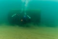 Munising, MI -August 11th, 2023: Multiple SCUBA divers exploring shipwreck remains Royalty Free Stock Photo