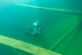 Munising, MI -August 13th, 2021: SCUBA diver entering wooden schooner shipwreck Royalty Free Stock Photo