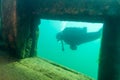 Munising, MI -August 14th, 2021: SCUBA diver exploring the Bermuda shipwreck