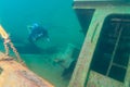 Munising, MI -August 11th, 2023: SCUBA diver exploring shipwreck remains