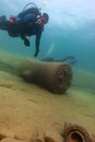 Munising, MI -August 14th, 2021: SCUBA diver exploring wooden steamer shipwreck