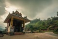 Munnar tea plantation cloudy sky indu temple with his shadow on the path