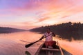 Canoe oarsman taking us on an early morning tour amidst serenely beautiful ashtamudi lake