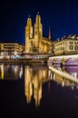 Munsterbrucke and Grossmunster church reflecting in river Limmat, Zurich, Switzerland...IMAGE