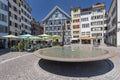 Munsterhof square with fountain and colorful buildings with cafe and restaurants in the old town of Zurich city in Switzerland