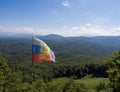 Muntain landscape on the background of Russian flag.