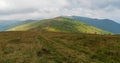 Muntii Valcan mountains in Romania covered by meadows with smaller rocks