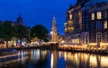 The Munttoren- Mint Tower Muntplein square, where the Amstel river and the Singel canal meet, Amsterdam, Netherlands. Royalty Free Stock Photo