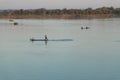 Muong Khong Laos 1.12.2012 Mekong river at sunset with and fishing boat and nets Royalty Free Stock Photo