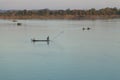 Muong Khong Laos 1.12.2012 Mekong river at sunset with and fishing boat and nets Royalty Free Stock Photo