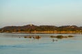 Muong Khong Laos 1/12/2012 Mekong river at sunset with and fishing boat and nets Royalty Free Stock Photo