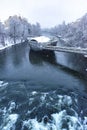 Mur river with Murinsel bridge in Graz, Steiermark region, Austria, with snow, in winter