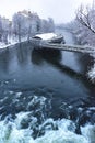 Mur river with Murinsel bridge in Graz, Steiermark region, Austria, with snow, in winter