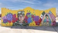 A mural by artist Juan Velazquez featuring Vanessa Guillen in Army fatigues on a business in Fort Worth, Texas.