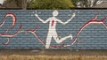 Mural on a barrier wall between Forest Lane and the neighborhood on the North side, painted in 1976 by art students.