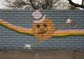 Mural on a barrier wall between Forest Lane and the neighborhood on the North side, painted in 1976 by art students.