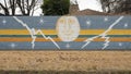 Mural on a barrier wall between Forest Lane and the neighborhood on the North side, painted in 1976 by art students.