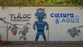 Mural featuring Tlaloc, the god of rain in Aztec religion, on a street in Santiago.