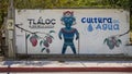 Mural featuring Tlaloc, the god of rain in Aztec religion, on a street in Santiago.