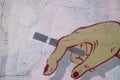 The mural, a hand holding a cigarette Royalty Free Stock Photo