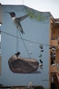 mural Hummingbird lifting a weight
