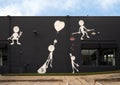 Mural by Kai featuring his Imaginary Friend on an outside wall of Markowicz Fine Art in Dallas, Texas.