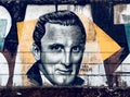 Mural of Kirk Douglas on old wall.