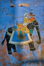 Mural of Maharajah on elephant on blue house wall in Jodhpur