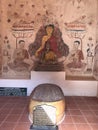 Mural painting and four Buddha footprints stacked together in the sanctuary of Buppharam temple Wat Buppharam or Wat Plai Khlong